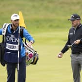 Richie Ramsay and caddie Scott Carmichael on the 18th green during the third round of the 151st Open. Picture: Tom Russo/The Scotsman.