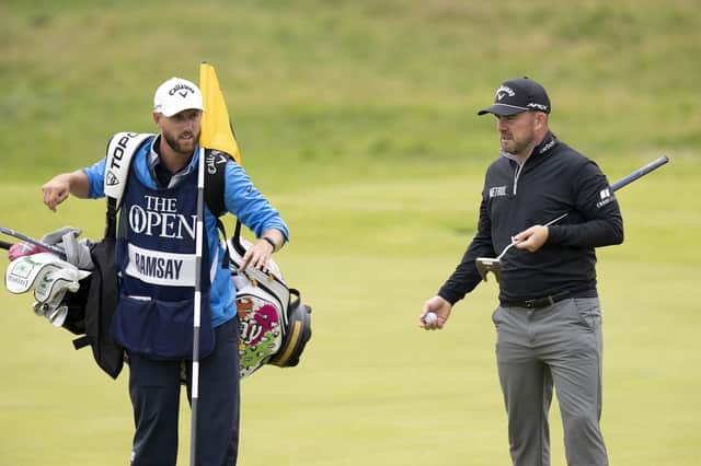 Richie Ramsay and caddie Scott Carmichael on the 18th green during the third round of the 151st Open. Picture: Tom Russo/The Scotsman.
