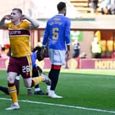 Motherwell forward Ross Tierney celebrates in front of the Rangers fans after making it 1-1 in his team's Premiership fixture at Fir Park. (Photo by Rob Casey / SNS Group)