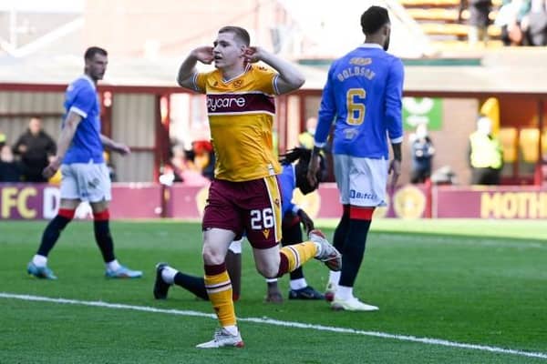 Motherwell forward Ross Tierney celebrates in front of the Rangers fans after making it 1-1 in his team's Premiership fixture at Fir Park. (Photo by Rob Casey / SNS Group)