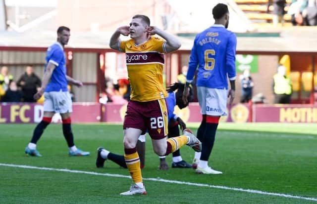 Motherwell forward Ross Tierney celebrates in front of the Rangers fans after making it 1-1 in his team's Premiership fixture at Fir Park. (Photo by Rob Casey / SNS Group)
