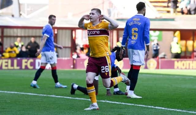 Motherwell forward Ross Tierney celebrates in front of the Rangers fans after making it 1-1 in his team's Premiership fixture at Fir Park. (Photo by Rob Casey / SNS Group)