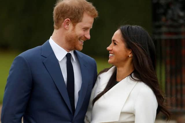 Happier times: Harry and Meghan before they gave up their royal duties and moved to the US.