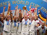 Captain Megan Rapinoe of the USA lifts the trophy as USA celebrate victory during the 2019 FIFA Women's World Cup. (Photo by Richard Heathcote/Getty Images)