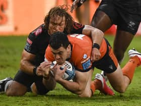 Werner Kok of the Sharks brings down Edinburgh's Emiliano Boffelli during the United Rugby Championship match at Kings Park in Durban. Photo by BackpagePix/Shutterstock (12864567h)