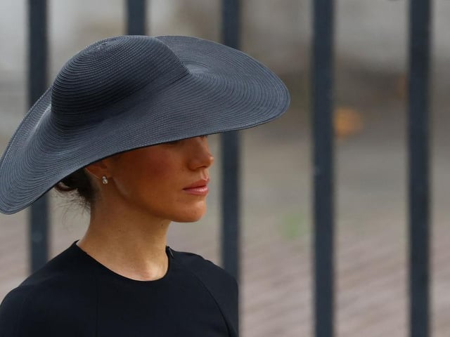 LONDON, ENGLAND - SEPTEMBER 19: Meghan, Duchess of Sussex arrives for the State Funeral of Queen Elizabeth II at Westminster Abbey on September 19, 2022 in London, England. Elizabeth Alexandra Mary Windsor was born in Bruton Street, Mayfair, London on 21 April 1926. She married Prince Philip in 1947 and ascended the throne of the United Kingdom and Commonwealth on 6 February 1952 after the death of her Father, King George VI. Queen Elizabeth II died at Balmoral Castle in Scotland on September 8, 2022, and is succeeded by her eldest son, King Charles III. (Photo by Hannah McKay - WPA Pool/Getty Images)
