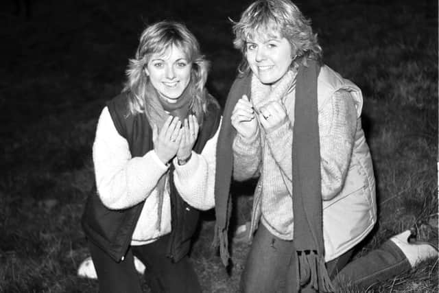 Alison Mitch and Lesley-Ann Mitch was their faces in the dew at the top of Arthur's Seat in Edinburgh, May Day 1983.