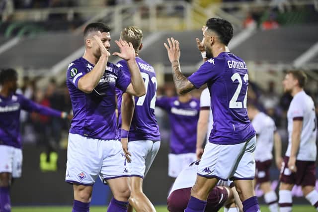 Fiorentina's Nicolas Gonzalez, right, celebrates with Luka Jovic after scoring his side's third goal against Hearts on Thursday.
