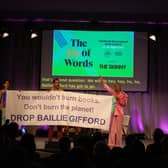 Author Mikaela Loach (far right) at the Edinburgh International Book Festival kickstarting a mass walkout from her panel show on the event's opening night to protest the festival having Baillie Gifford as one of its sponsors (pic: Harvey Blackmore)