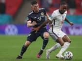 Scotland's Billy Gilmour, seen challenging Raheem Sterling, was man of the match in the game against England (Picture: Carl Recine/pool/AFP via Getty Images)