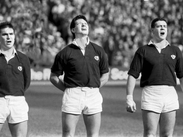 Scottish team members Iwan Tukalo, Sean Lineen and Scott Hastings singing before the match.