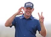 Lee Westwood jokingl gestures to a photographer about a recent English Premier League result during a practice round prior to the Abu Dhabi HSBC Championship at Yas Links. Picture: Ross Kinnaird/Getty Images.