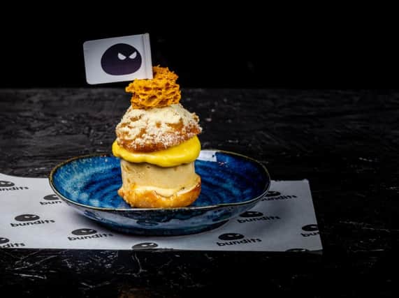 Deep fried bao with honeycomb, banana and passionfruit curd
