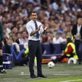 Rangers manager Giovanni van Bronckhorst attempts to spur his players from the touchline during the 4-0 defeat at Ajax. (Photo by MAURICE VAN STEEN/AFP via Getty Images)