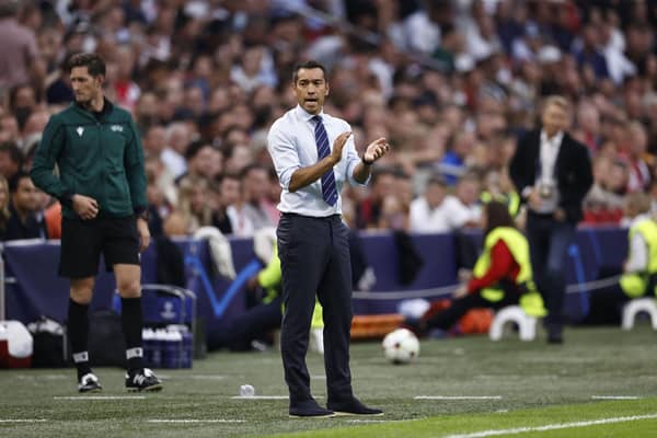 Rangers manager Giovanni van Bronckhorst attempts to spur his players from the touchline during the 4-0 defeat at Ajax. (Photo by MAURICE VAN STEEN/AFP via Getty Images)
