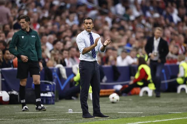 Rangers manager Giovanni van Bronckhorst attempts to spur his players from the touchline during the 4-0 defeat at Ajax. (Photo by MAURICE VAN STEEN/AFP via Getty Images)