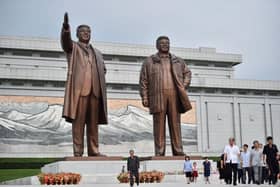People leave after paying their respects before the statues of late North Korean leaders Kim Il Sung and Kim Jong Il at Mansu Hill this week as North Korea marks its 78th National Liberation Day, commemorating the end of Japanese colonial rule at the end of World War II. The country is just beginning to allow citizens to return after the Covid pandemic.