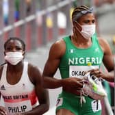 Great Britain's Asha Philip and Nigeria's Blessing Okagbare after the Women's 100m Round 1 Heat 6 at Olympic Stadium on the seventh day of the Tokyo 2020 Olympic Games in Japan. The Nigerian will no longer be eligible for the final races. (Photo credit: Martin Rickett/PA Wire)
