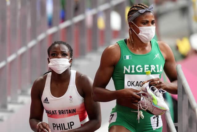 Great Britain's Asha Philip and Nigeria's Blessing Okagbare after the Women's 100m Round 1 Heat 6 at Olympic Stadium on the seventh day of the Tokyo 2020 Olympic Games in Japan. The Nigerian will no longer be eligible for the final races. (Photo credit: Martin Rickett/PA Wire)