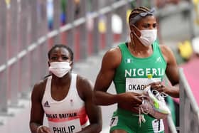 Great Britain's Asha Philip and Nigeria's Blessing Okagbare after the Women's 100m Round 1 Heat 6 at Olympic Stadium on the seventh day of the Tokyo 2020 Olympic Games in Japan. The Nigerian will no longer be eligible for the final races. (Photo credit: Martin Rickett/PA Wire)