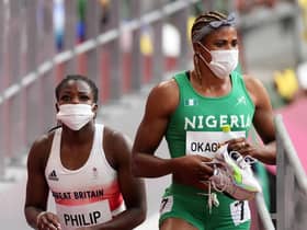 Great Britain's Asha Philip and Nigeria's Blessing Okagbare after the Women's 100m Round 1 Heat 6 at Olympic Stadium on the seventh day of the Tokyo 2020 Olympic Games in Japan. The Nigerian will no longer be eligible for the final races. (Photo credit: Martin Rickett/PA Wire)