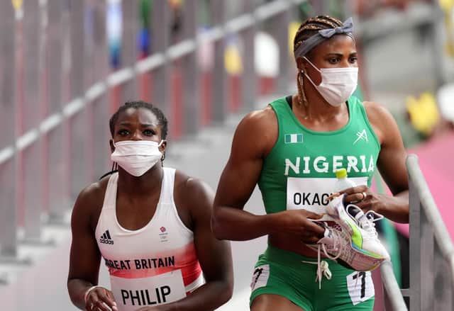 Great Britain's Asha Philip and Nigeria's Blessing Okagbare after the Women's 100m Round 1 Heat 6 at Olympic Stadium on the seventh day of the Tokyo 2020 Olympic Games in Japan. The Nigerian will no longer be eligible for the final races. (Photo credit: Martin Rickett/PA Wire)