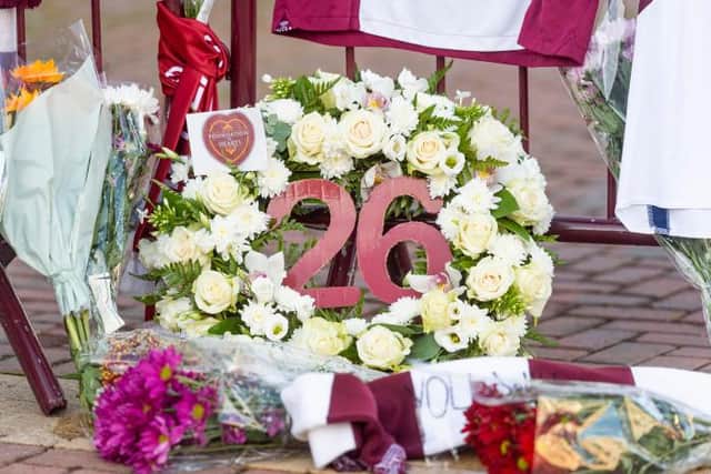 Tributes have been left in honour of Zaliukas at Tynecastle .
