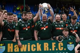 The Hawick players celebrate with the trophy after winning the Tennent's Premiership final against Currie Chieftains.
