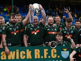 The Hawick players celebrate with the trophy after winning the Tennent's Premiership final against Currie Chieftains.
