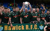 The Hawick players celebrate with the trophy after winning the Tennent's Premiership final against Currie Chieftains.