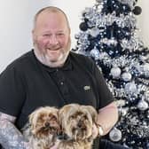 Bobby Jones with his two Yorkshire terriers in his new Irvine home