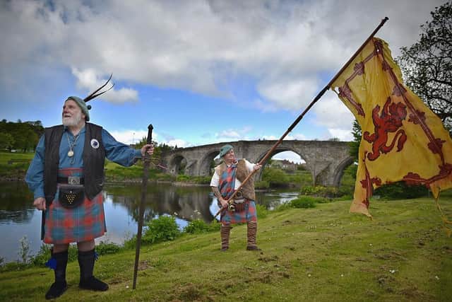 Experts believe the 'Braveheart effect' still resonates with visitors today as much as it did 25 years ago when the film was released. Eddie McNeill and Malcolm McNeill from the Wallace Soiciety attend attend a ceremony at the Stirling Bridge Battle Site  in 2015 (Photo by Jeff J Mitchell/Getty Images)