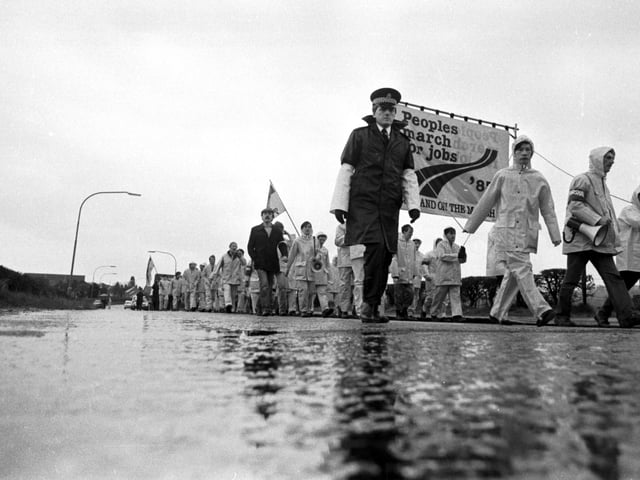 Police walk alongside the Peoples March for Jobs in the Borders in April 1983