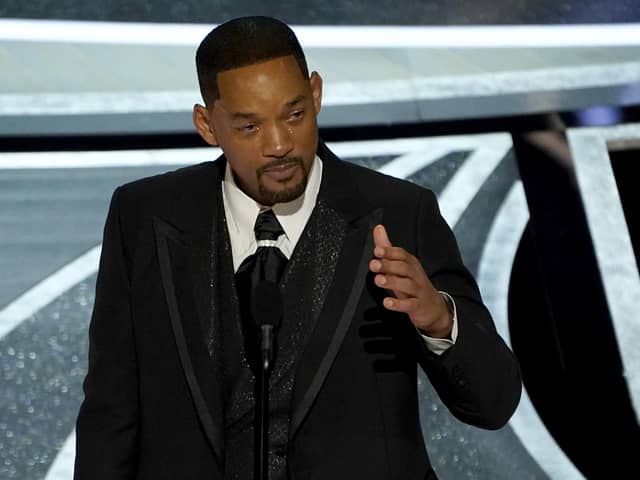 Will Smith cries as he accepts the award for best performance by an actor in a leading role for "King Richard" at the Oscars on Sunday, March 27, 2022, at the Dolby Theatre in Los Angeles. (AP Photo/Chris Pizzello)