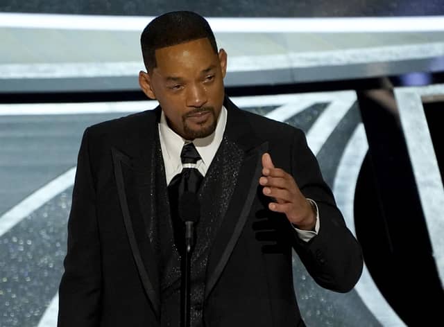 Will Smith cries as he accepts the award for best performance by an actor in a leading role for "King Richard" at the Oscars on Sunday, March 27, 2022, at the Dolby Theatre in Los Angeles. (AP Photo/Chris Pizzello)