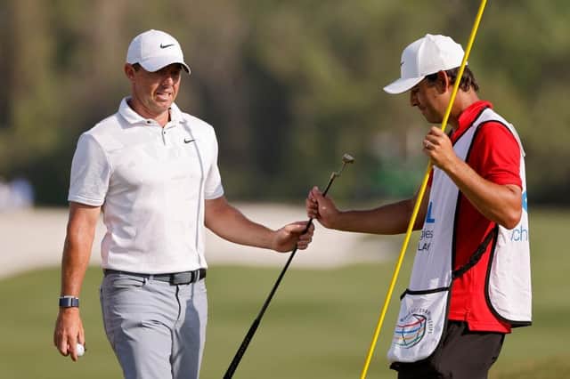 Rory McIlroy hands his putter to caddie Harry Diamond during the final day of the WGC-Dell Technologies Match Play at Austin Country Club in Texas. Picture: Mike Mulholland/Getty Images.