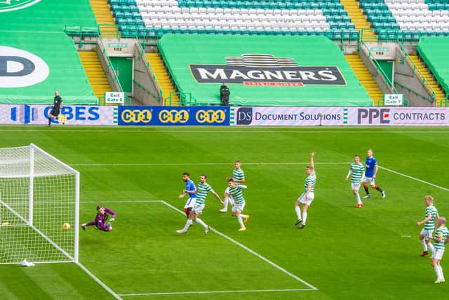 Connor Goldson heads in the opening goal of the game for Rangers. Picture: SNS