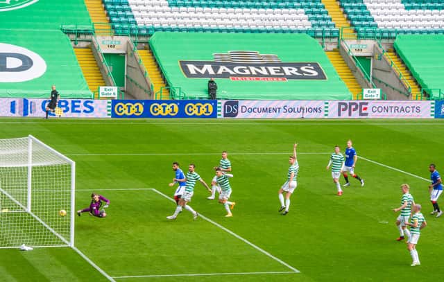 Connor Goldson heads in the opening goal of the game for Rangers. Picture: SNS