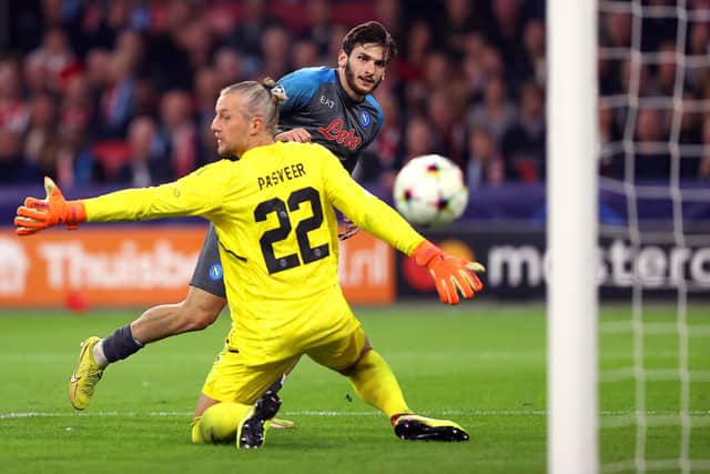 Khvicha Kvaratskhelia of SSC Napoli scores their team's fifth goal past Remko Pasveer of Ajax during the UEFA Champions League group A match between AFC Ajax and SSC Napoli at Johan Cruyff Arena.