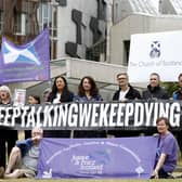 The group Faces And Voices of Recovery hold a protest outside the Scottish Parliament in July 2022 as Scotland’s drugs death figures were published (Picture: Jeff J Mitchell/Getty Images)