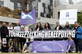 The group Faces And Voices of Recovery hold a protest outside the Scottish Parliament in July 2022 as Scotland’s drugs death figures were published (Picture: Jeff J Mitchell/Getty Images)