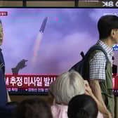 A TV screen shows a file image of North Korea's missile launch during a news program at the Seoul Railway Station in Seoul, South Korea. Picture: AP Photo/Ahn Young-joon