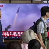 A TV screen shows a file image of North Korea's missile launch during a news program at the Seoul Railway Station in Seoul, South Korea. Picture: AP Photo/Ahn Young-joon