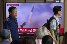 A TV screen shows a file image of North Korea's missile launch during a news program at the Seoul Railway Station in Seoul, South Korea. Picture: AP Photo/Ahn Young-joon