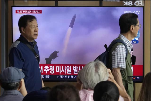 A TV screen shows a file image of North Korea's missile launch during a news program at the Seoul Railway Station in Seoul, South Korea. Picture: AP Photo/Ahn Young-joon