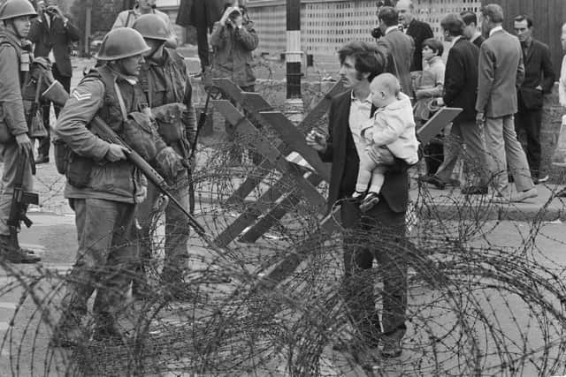 Soldiers and civilians in Northern Ireland during the Troubles in 1969 (Picture: Evening Standard/Hulton Archive/Getty Images)