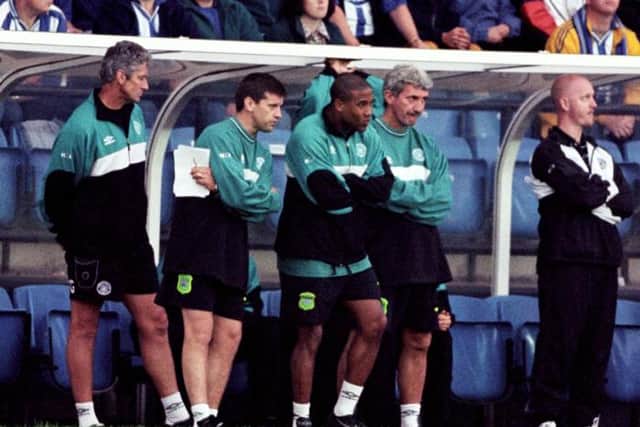 Terry McDermott watches the 1999 fixture with Kilmarnock with Eric Black and Celtic head coach John Barnes (3rd left)