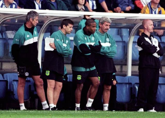 Terry McDermott watches the 1999 fixture with Kilmarnock with Eric Black and Celtic head coach John Barnes (3rd left)