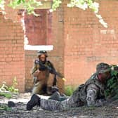 A British soldier and Ukrainian soldiers take part in urban combat exercises at a British Army military base in Northern England last week.