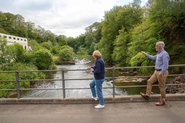 Senior civil engineer Anne Kerr and head of hydro Ian Kinnaird view the power station from a bridge over the River Clyde. Picture: William Wilson Photography